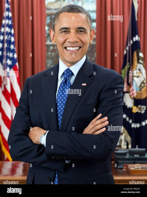 PRESIDENT BARACK OBAMA poses for an official photo in the Oval Office ...