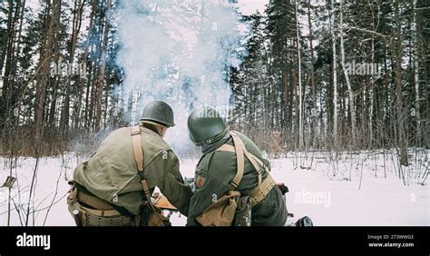 Back View On Re-enactors Dressed As American Infantry Soldiers Fire ...