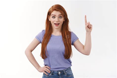 Amused Good Looking Modern Young Redhead 20s Girl In T Shirt Raising