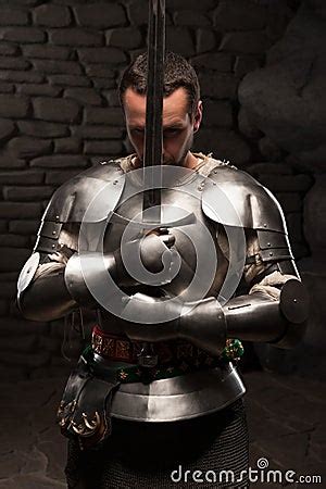 Medieval Knight Kneeling With Sword Stock Photo - Image: 42214271