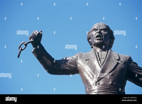 Detail of a statue of Father Hidalgo links of chain held symbolically ...