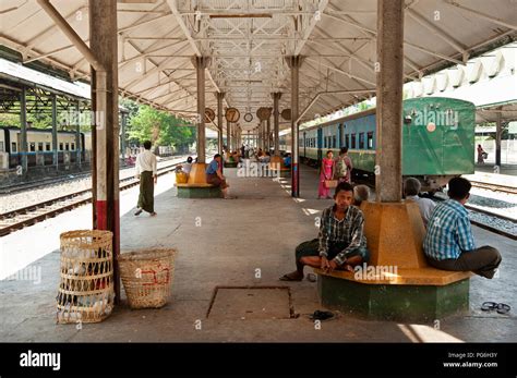 Burmese people waiting on a railway platform in Yangon station Myanmar ...