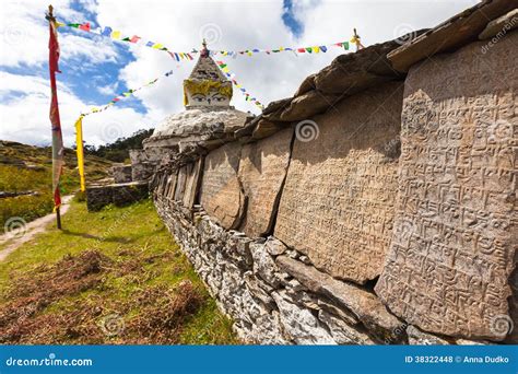 Mani Wall And Stone With Buddhist Symbols, Nepal Stock Photography ...