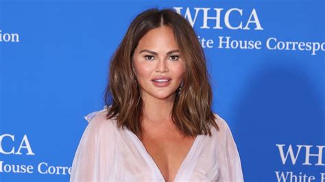 Chrissy Teigen Shows Off Toned Legs In Intricate Voluminous Mini Dress