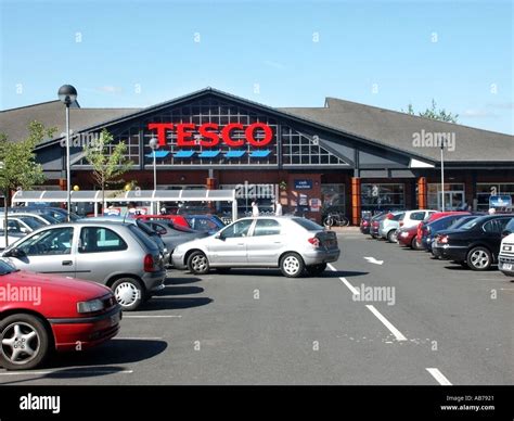 Ledbury Hereford Herefordshire smaller Tesco supermarket store in country town car manoeuvring ...