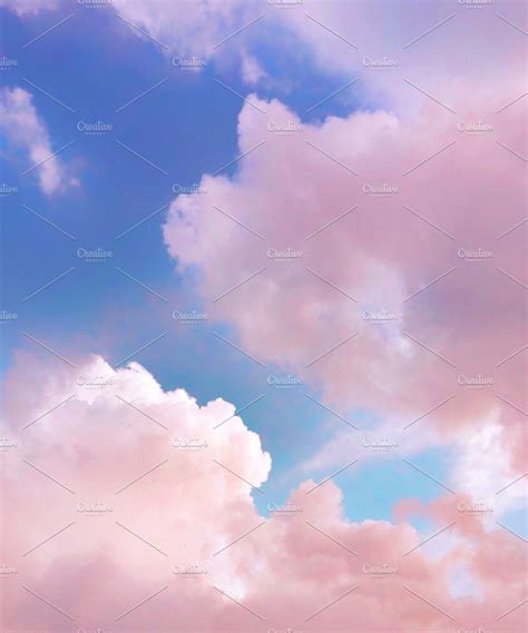 The Sky Is Filled With Pink And Blue Clouds