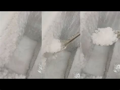 POWDERY FROST SCRAPING AND EATING FROM STEEL SPOON ICE