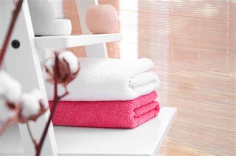 Premium Photo Clean Towels On Shelf In Bathroom