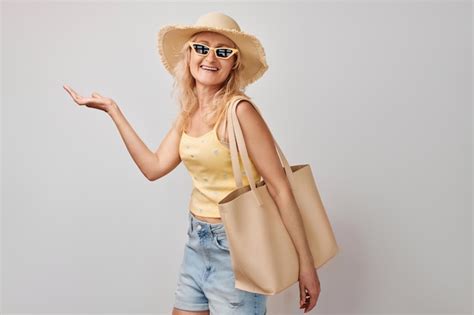 Premium Photo Beautiful Mature Woman Years Old Holding Something In Hand Demonstrating