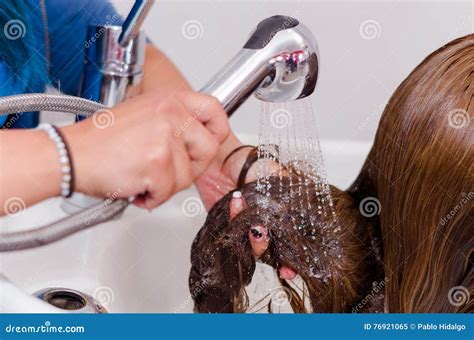 Inside Hairdressing Saloon, Woman Hands Washing a Long Hair with Cold ...