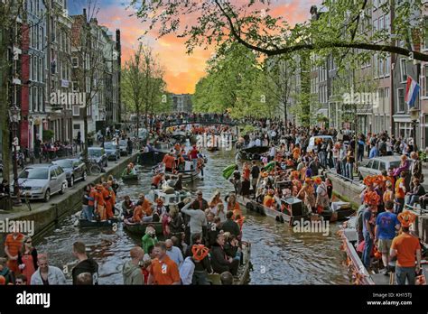 AMSTERDAM NETHERLANDS APRIL 27 People Celebrating Kings Day On The