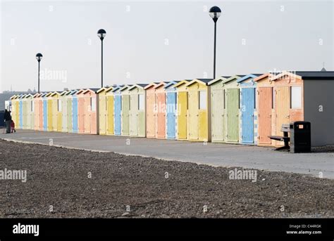 Row Of Pastel Coloured Beach Huts On The Beach At Seaford In East