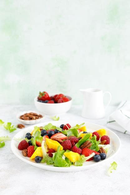 Premium Photo Fruit And Berry Salad With Strawberry Blueberry