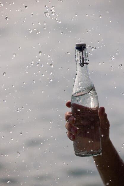 Premium Photo Bottle With Pure Water And Splash Around It