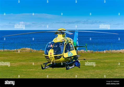 Scottish Air Ambulance The Helicopter On Grass Moray Coast Scotland