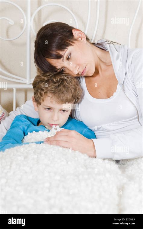 Mother Comforting Her Son Stock Photo Alamy