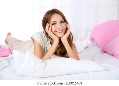 Стоковая фотография 232138738 Young Beautiful Woman Lying Bed