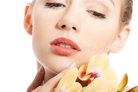 Portrait Of Nude Woman With An Orchid Flower Stock Image Image Of Makeup Look
