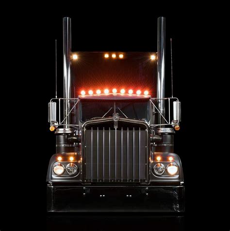 Front End Of A Semi Truck With Lights On