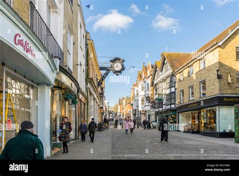 People Walking Along Winchester High Street With Winchester High Street