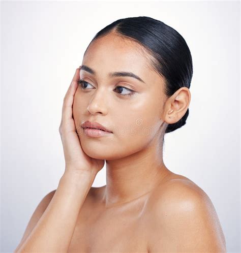 Natural Beauty And Woman With Hands On Face In Studio For Glow