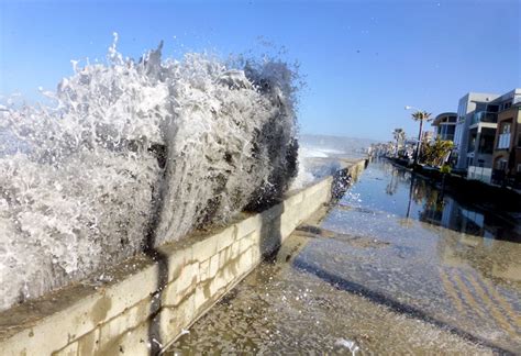 High tide, big waves splash Mission Beach