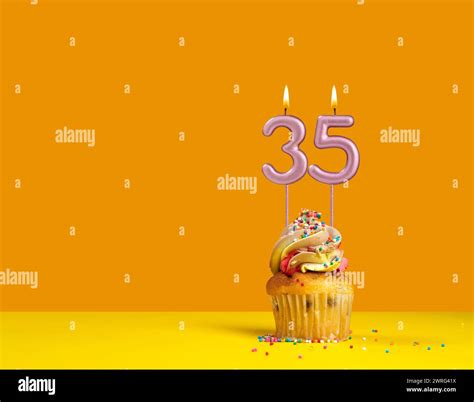 Birthday celebration with cupcake - Candle number 35 Stock Photo - Alamy