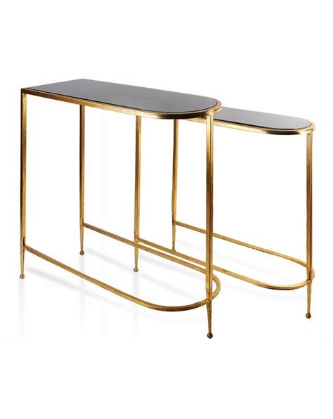 Two Gold Metal And Glass Tables With Black Tops One On The Left And