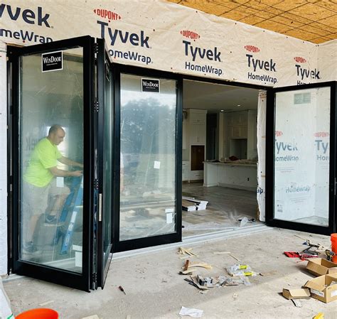 Adele - Love these new 16'-wide bi-fold sliding glass door we installed