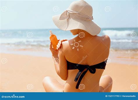 Woman Apply Sun Cream Protection Cream On Her Tanned Shoulder