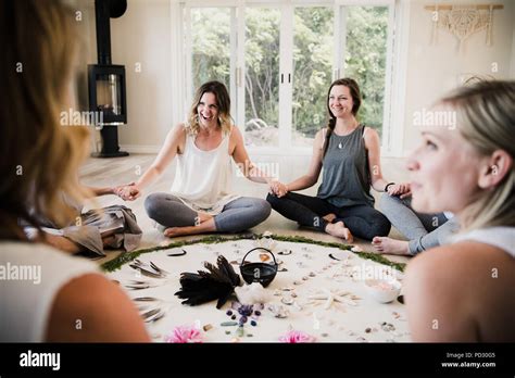 Women around circle in yoga retreat Stock Photo - Alamy