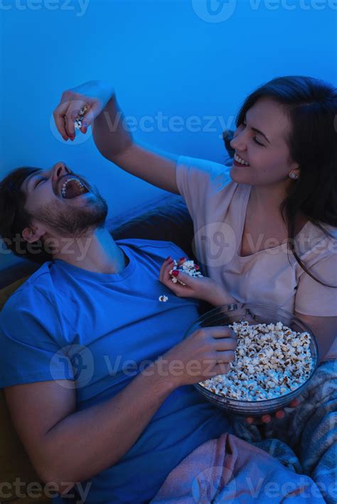 Young And Happy Couple Eating Popcorn And Watching Movie 14407625 Stock