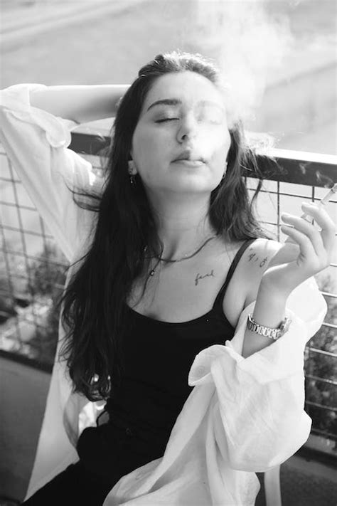 Woman Smoking Cigarette in Black and White · Free Stock Photo