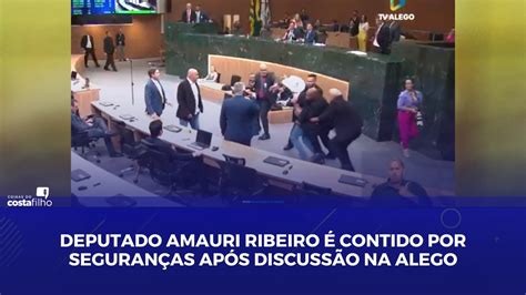 Deputado Amauri Ribeiro é contido por seguranças após discussão na