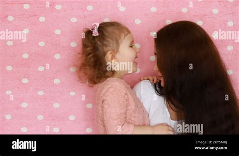 Mother And Daughter Embrace Smiles Have Fun Laugh And Kissed Close