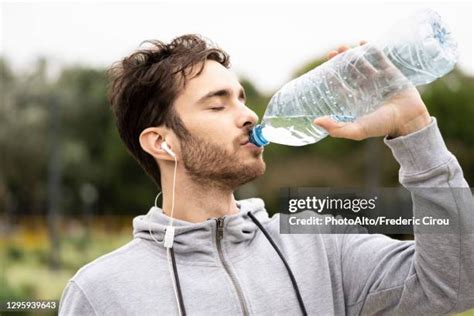 Man Drink From Bottle Photos And Premium High Res Pictures Getty Images