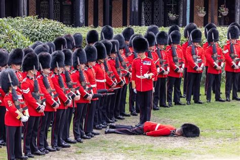 Royal Guard Collapses Face First To Ground After Fainting At Queen