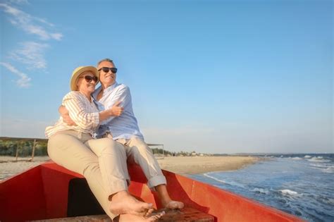 Premium Photo Happy Mature Couple In Boat At Sea Resort