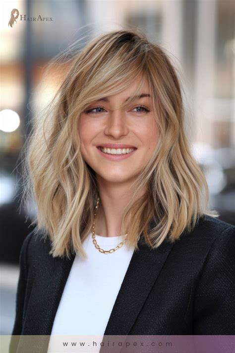 Hair experts explain why face shapes suit side swept bangs with layers 23
