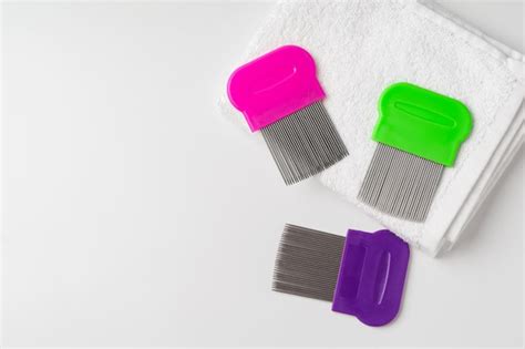 Premium Photo Anti Lice Combs And Towel On White Background