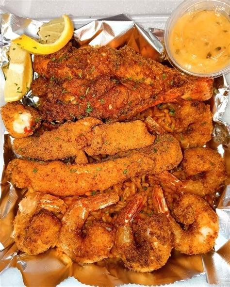 Fried Lobster Tail Fried King Crab Legs Fried Jumbo Shrimp On Top Of