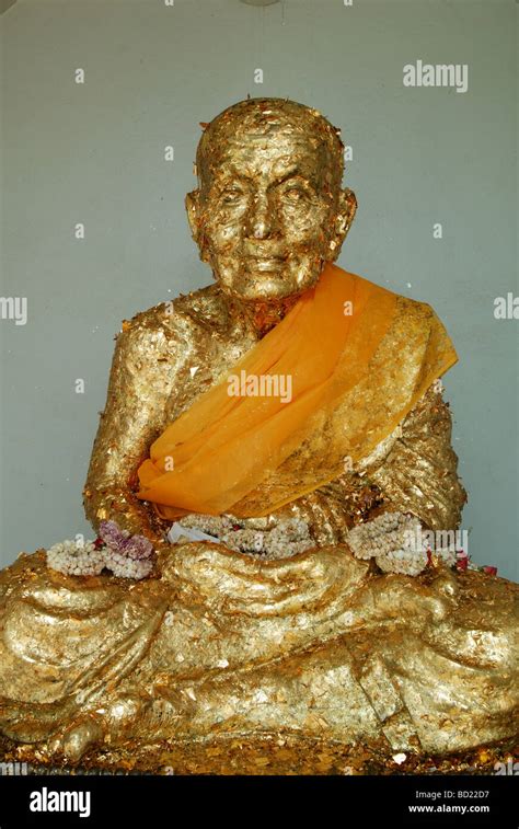 Buddhist Monk Statue Covered In Leaf Gold Stock Photo Alamy