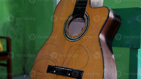 Broken classic acoustic guitar 26162752 Stock Photo at Vecteezy