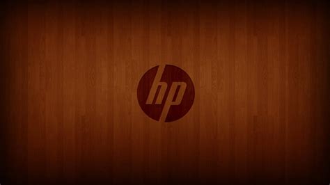 Download Wood Engraved Hp Laptop Logo Wallpaper | Wallpapers.com