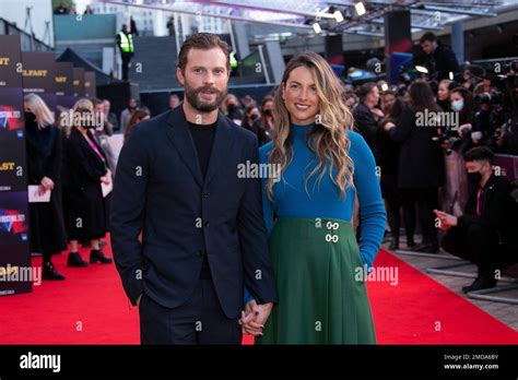 Jamie Dornan Left And Amelia Warner Pose For Photographers Upon