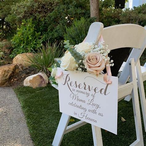 A Wooden Chair With A Sign On It That Says Reserved To Someone At A