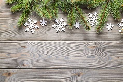 Christmas background - spruce tree and snowflakes on wooden boar ...