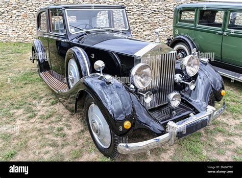 A Front View Of A Classic Mesmerizing Rolls Royce Phantom With Long Body Kit And Vintage Design