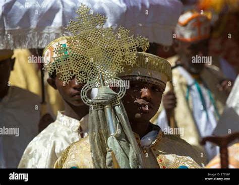 Ethiopian Orthodox Priest Holding A Cross During The Colorful Timkat