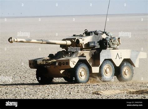 A French Panhard ERC 90 armored car moves across the desert as part of ...